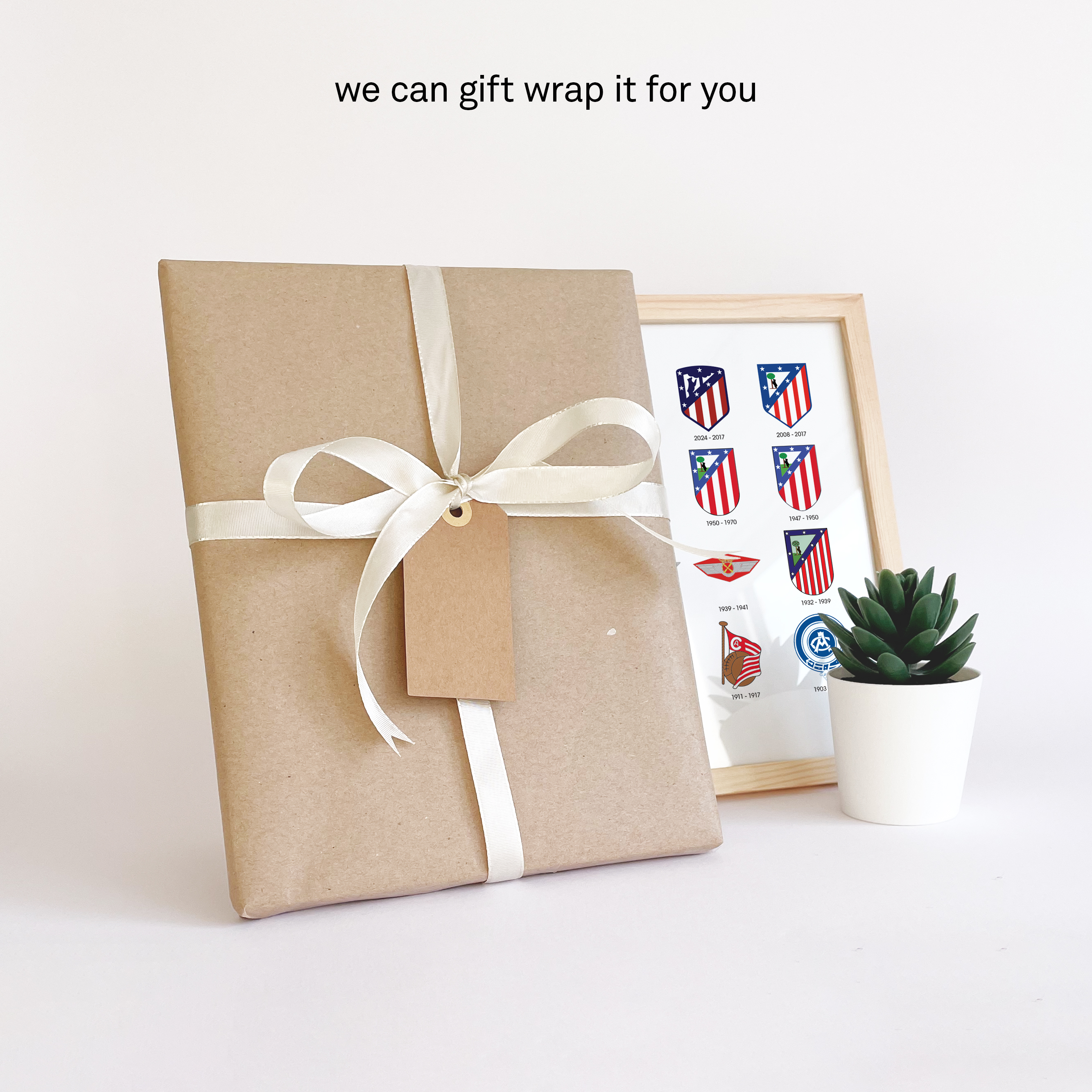 Atletico Logo History print giftwrapped in brown durable paper with a white ribbon and a personal note card so you can send it directly to that special person